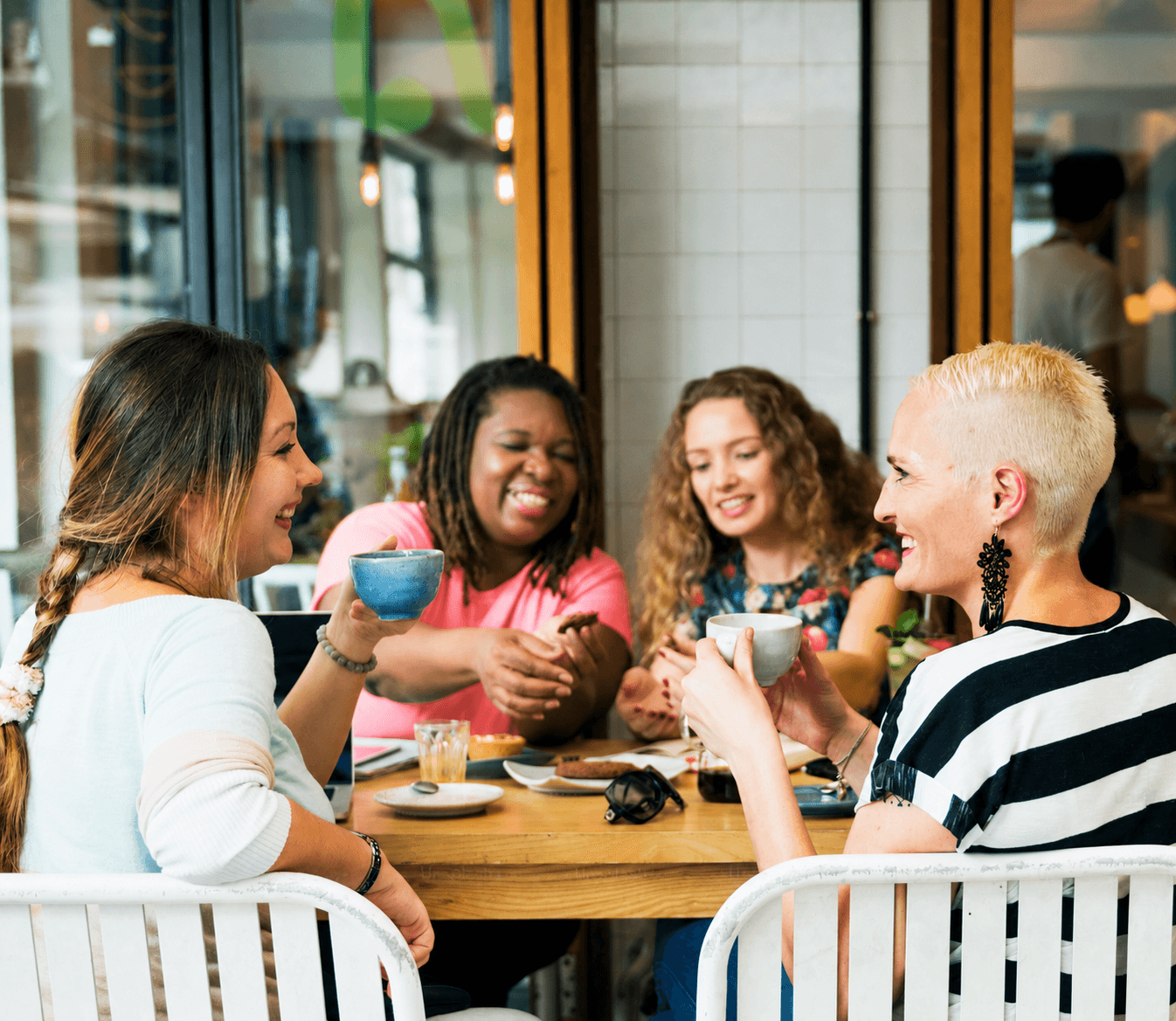 Immigrants connecting and sharing a moment on their settlement journey