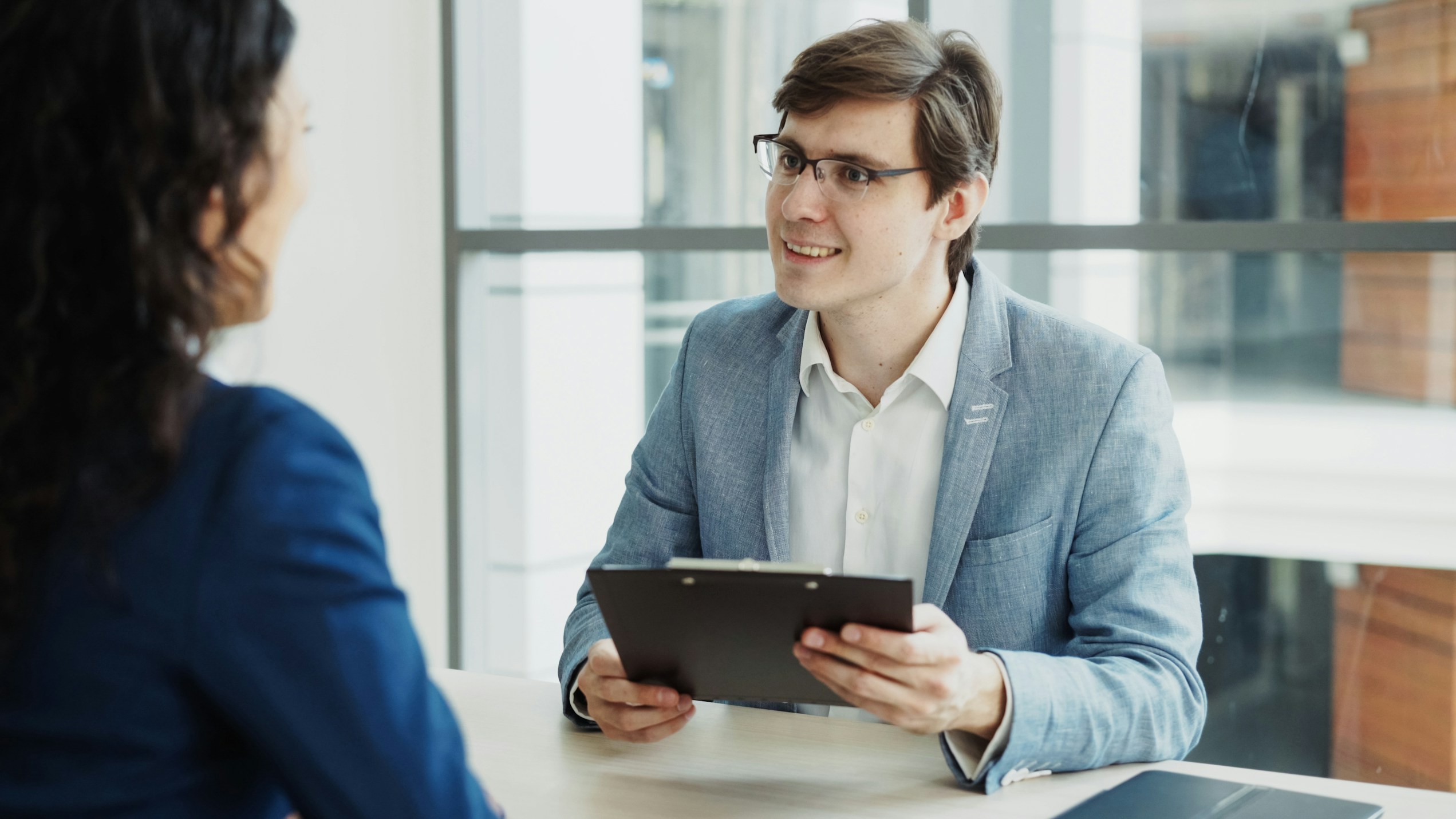 Immigration expert reviewing documents with a client